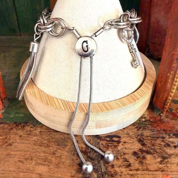 GUESS Silver Tone Heart Charm Bolo Bracelet with Rhinestones - Picture 5 of 11